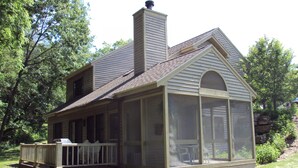 A house with a screened porch and a chimney. - 2 Bedroom, 2 bath home in The Galena Territory.  Close to Eagle Ridge Resort (Galena)