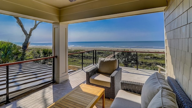 A covered outdoor seating area with a view of the beach. - Perfect 10 Sea Hawk-Spectacular Oceanfront Dream House in Absolute Best Location (Hilton Head Island)
