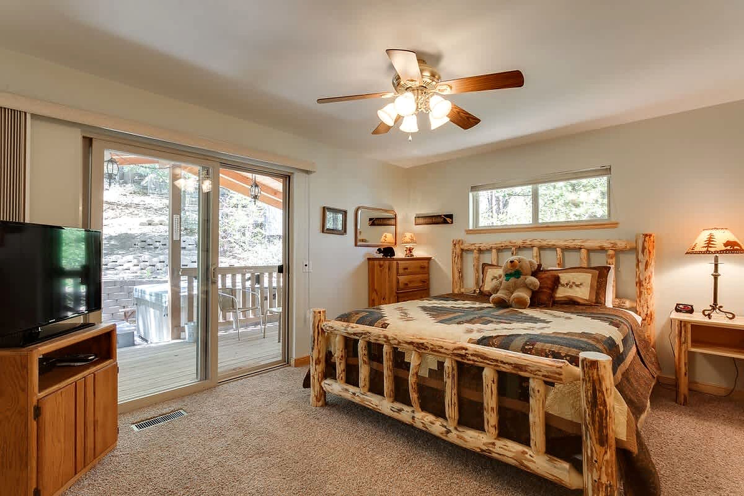 Bedroom 1 with doors to the hot tub deck