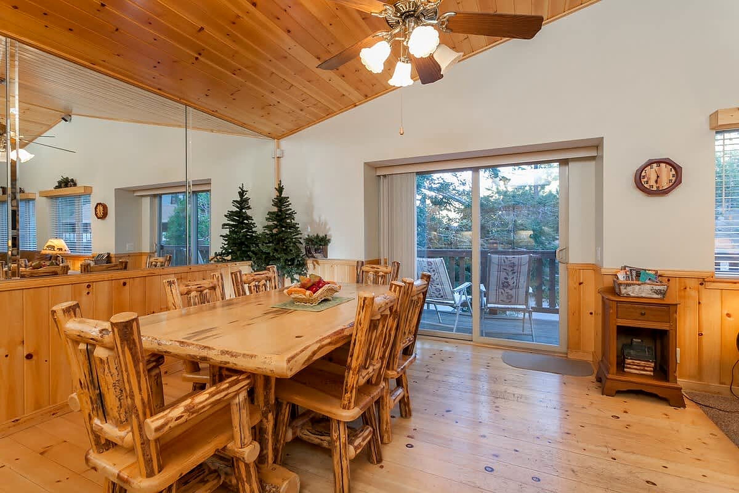 Log dining table with doors to the deck