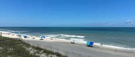 On the beach, sun-loungers