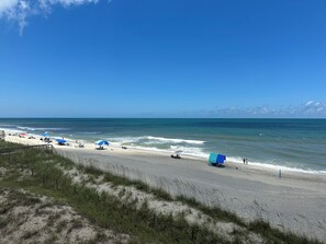 On the beach, sun-loungers