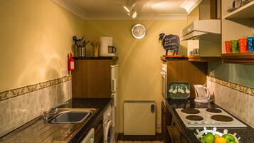 Standard Apartment, 1 Bedroom | Private kitchen | Full-size fridge, microwave, oven, stovetop