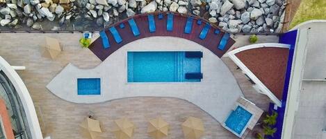 Outdoor pool, open 7:00 AM to 10:00 PM, pool loungers