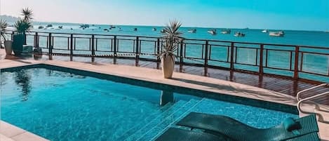 Outdoor pool, open 7:00 AM to 10:00 PM, pool loungers