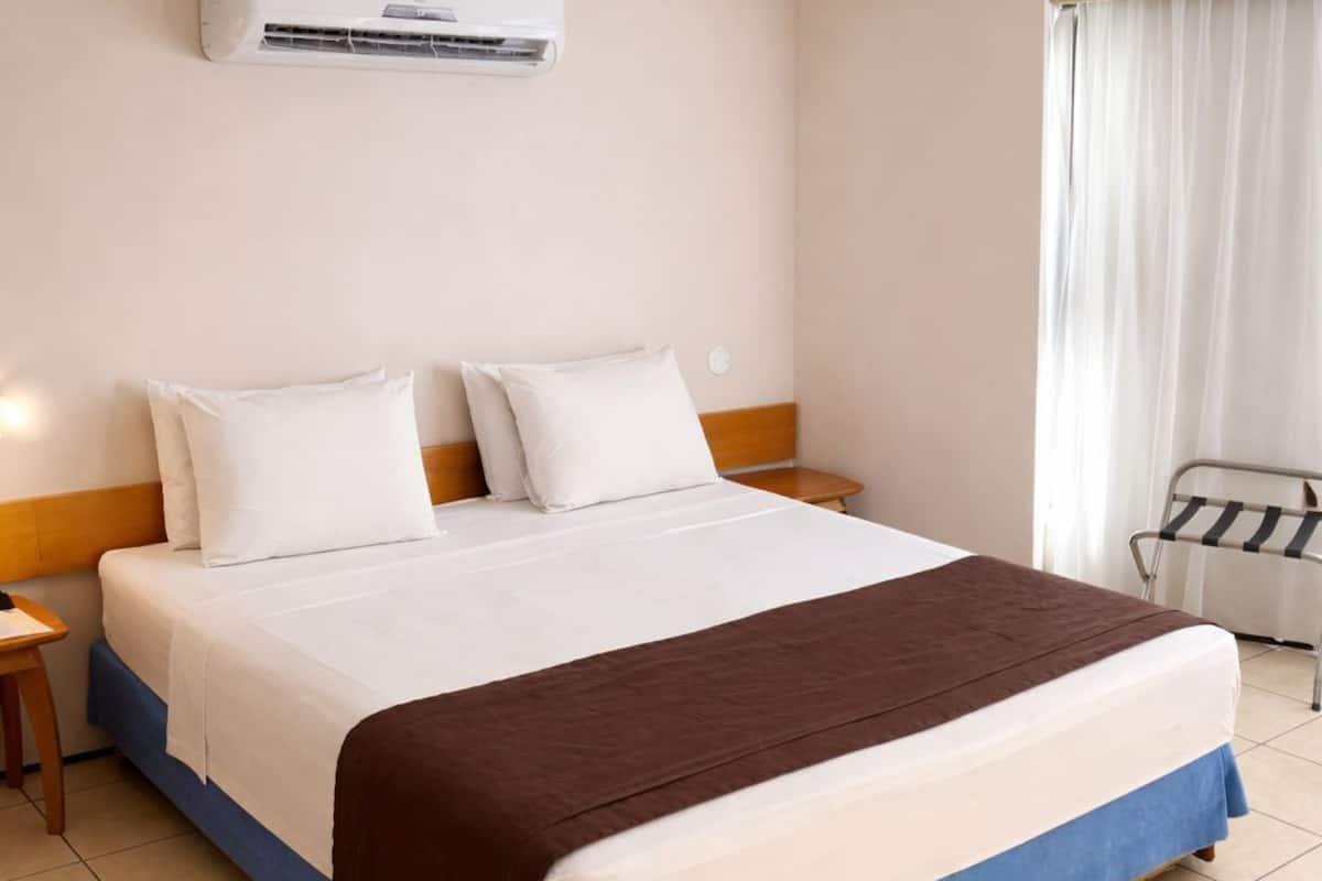 Standard Double Room, Sea View | Minibar, in-room safe, desk, laptop workspace