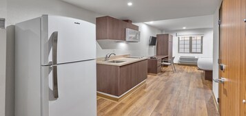 Suite, 1 Queen Bed | Desk, blackout drapes, bed sheets