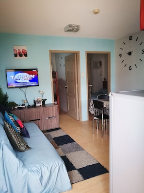 Family Apartment, 2 Bedrooms | Living area | Flat-screen TV - Sorrento 2BR Apartment (Pasig)