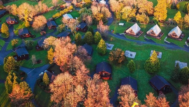 An aerial view of a residential area with multiple houses, roads, and trees. - Birch 22 With Hot Tub, Newton Stewart (Newton Stewart)