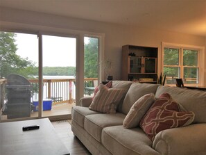 Deluxe Cottage, 4 Bedrooms, Lake View, Beachfront | Living area | Flat-screen TV, fireplace