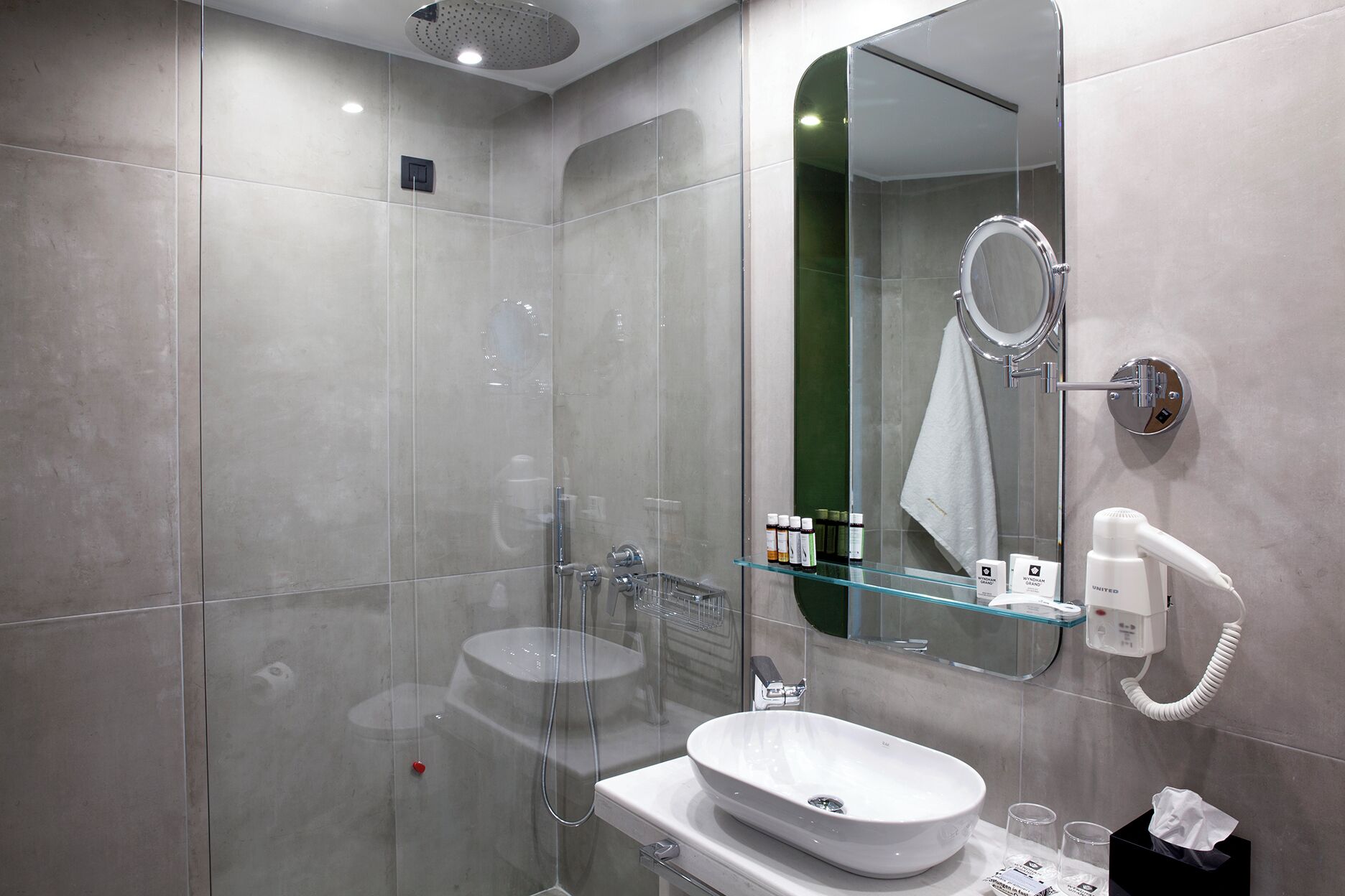 junior suite, city view | bathroom | shower, designer toiletries, hair dryer, bathrobes