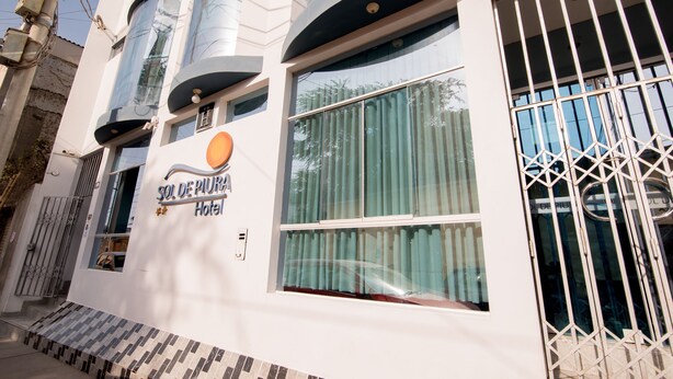 A hotel with a modern facade, large windows, and a visible entrance. - Hotel Sol de Piura (Piura)