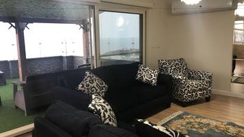 Luxury Apartment, 2 Bedrooms, Beach View | Living area | TV