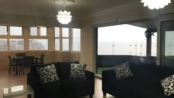 Luxury Apartment, 2 Bedrooms, Beach View | 2 bedrooms, free minibar, individually furnished, iron/ironing board