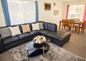 House, 2 Bedrooms, 2 Bathrooms (2-Bedroom House plus Caravan sleeps 2) | Living room | Flat-screen TV, DVD player - Manilla Cottage - Manilla NSW (Manilla)