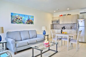 Condo, 1 Bedroom | Living area | Flat-screen TV - Pearl Aruba Condos (Oranjestad)