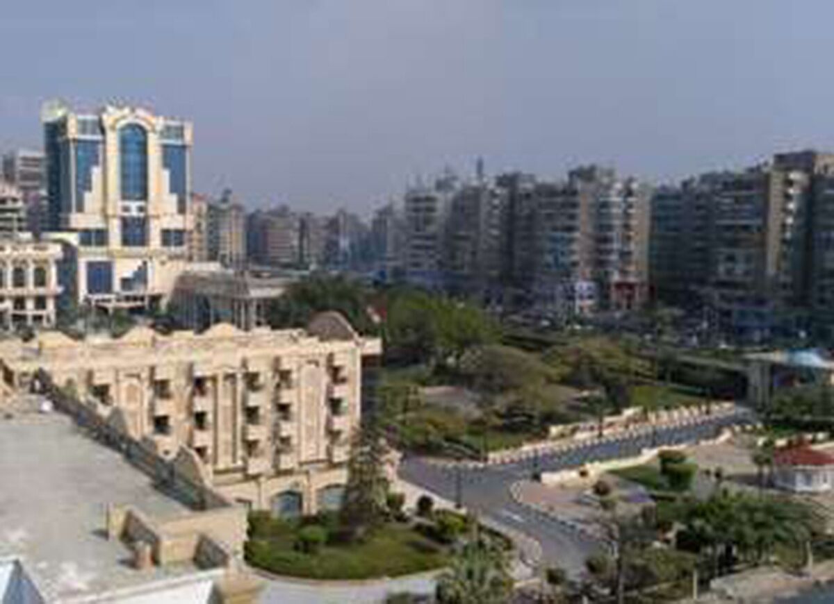 A large building with a central courtyard and multiple floors.