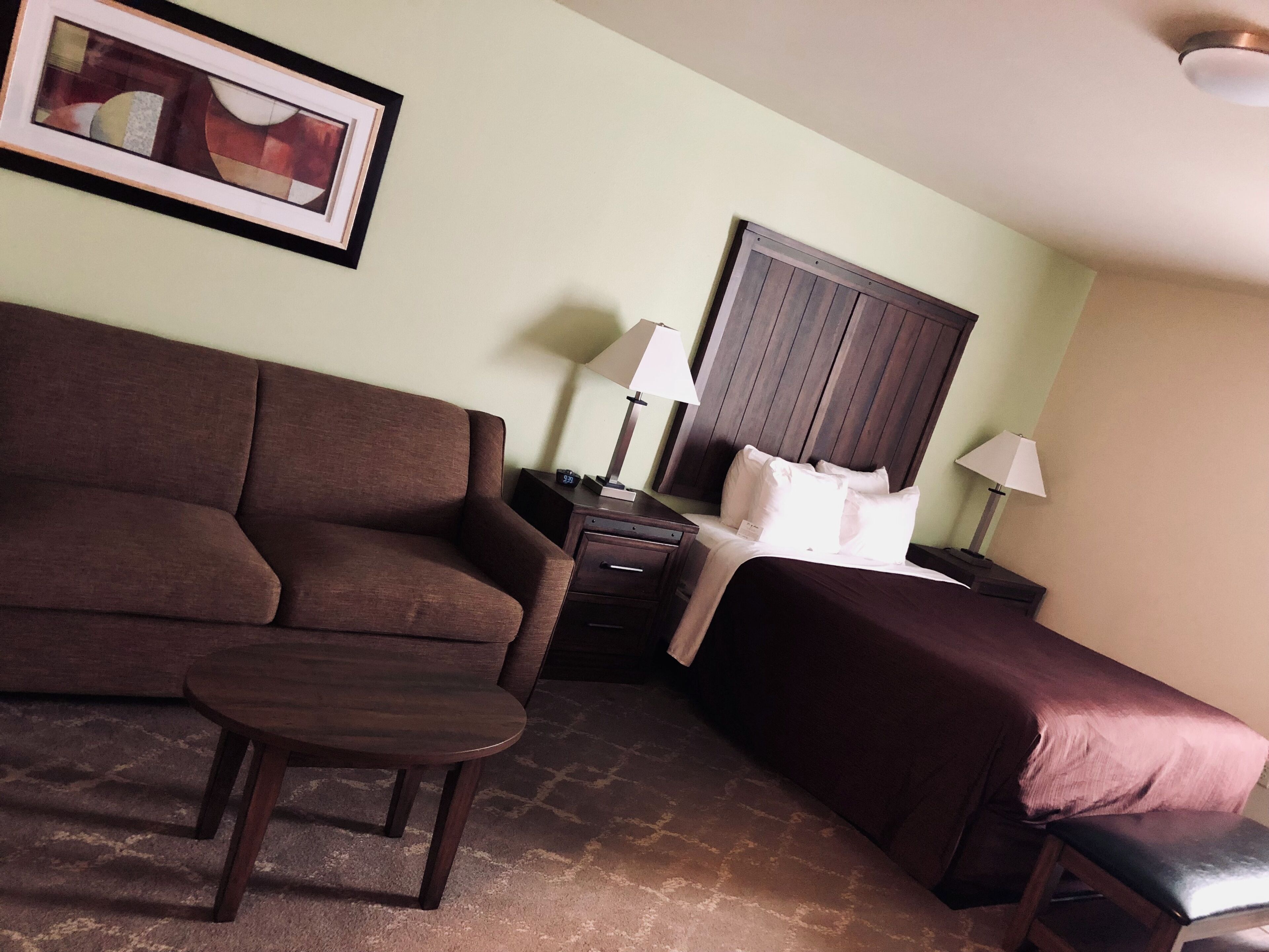 deluxe studio suite, 1 queen bed, kitchenette | premium bedding, desk, iron/ironing board, travel cot