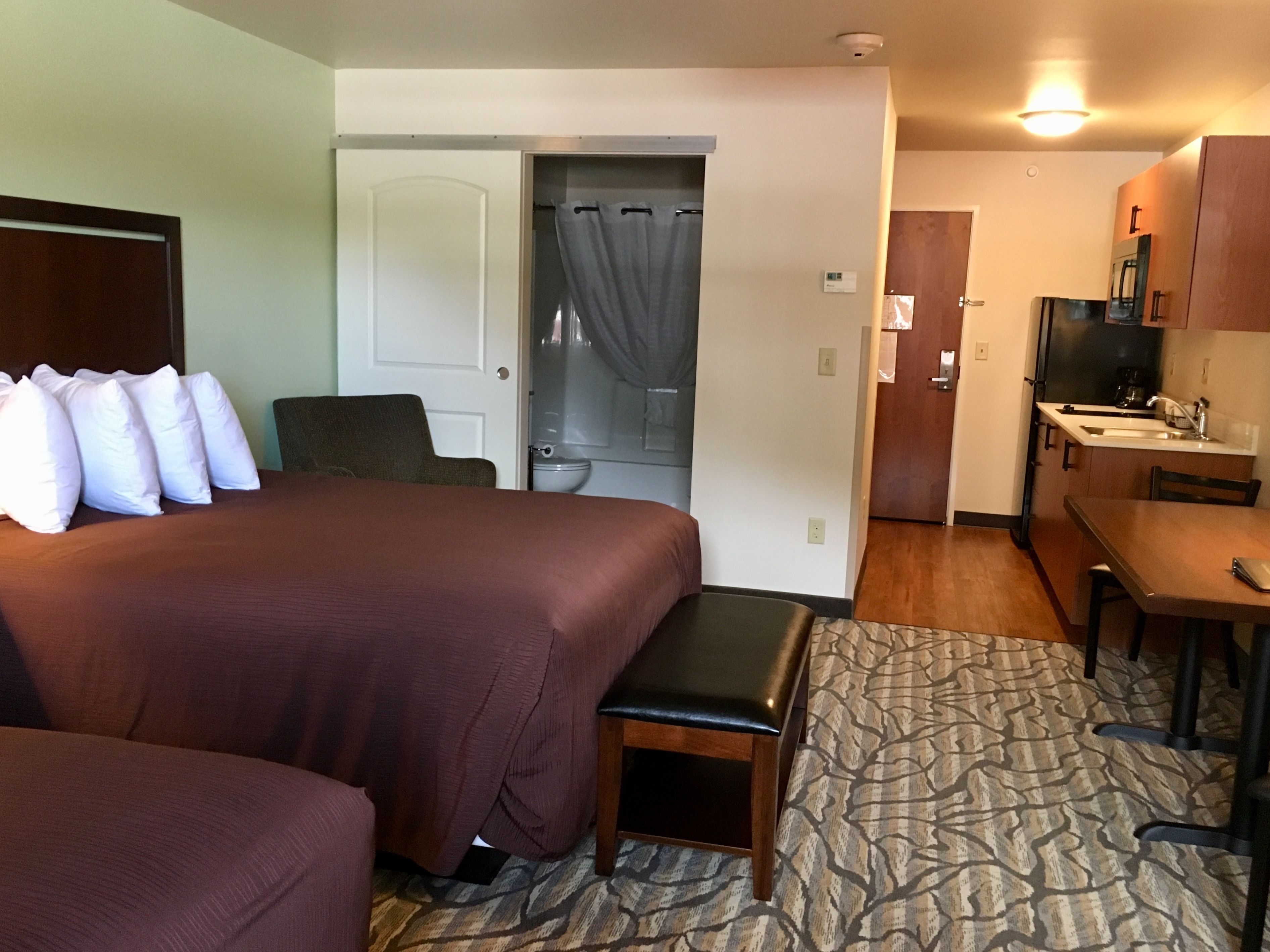 deluxe studio suite, 2 queen beds, kitchenette | premium bedding, desk, iron/ironing board, travel cot