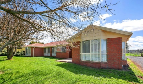 A two-story brick house with a red roof, large windows, and a well-maintained lawn. - Impressive Hobby Farm Close in Bungaree (Bungaree)