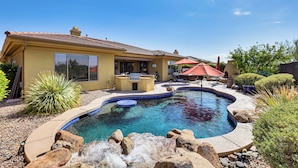 A house with a swimming pool, patio furniture, and a red umbrella. - Pool, Hot Tub & Golf Course View! ‘Anthem Oasis’ (Anthem)