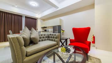 Executive Suite, 2 Bedrooms | Living area | 32-inch LED TV with digital channels, TV