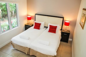 Deluxe Apartment, 2 Bedrooms, Pool View | 2 bedrooms, premium bedding, individually decorated