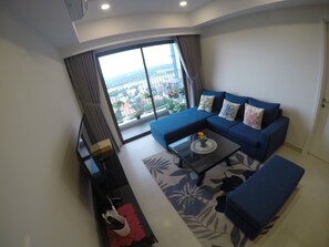 Apartment | Living room | Flat-screen TV - Riverfront Osis Resort Balcony (Ho Chi Minh City)