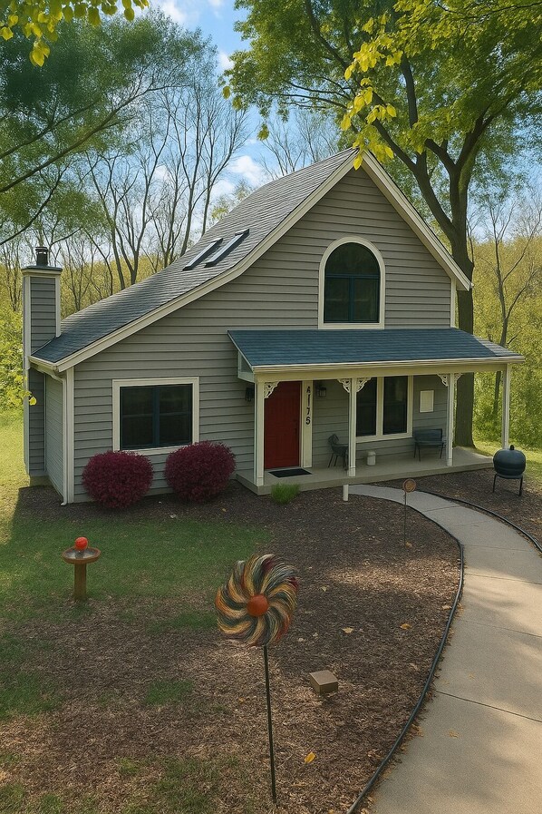 A two-story house with a front porch, a chimney, and a mailbox. - Ultimate Vacation Getaway - Family/Friends Cozy Retreat (Galena)