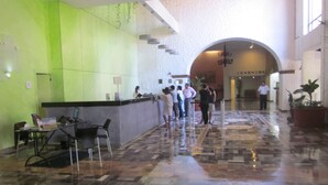A lobby with a reception desk, a waiting area with chairs, and a tiled floor. - Oceanfront 2 Bedroom, Spectacular Ocean Views, 59.00/nt May-Oct, monthly rental (Puerto Vallarta)