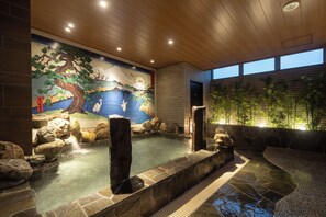 A hot spring area with a mural, wooden ceiling, and bamboo wall. - Dormy Inn Korakuen Hot Springs (Tokyo)