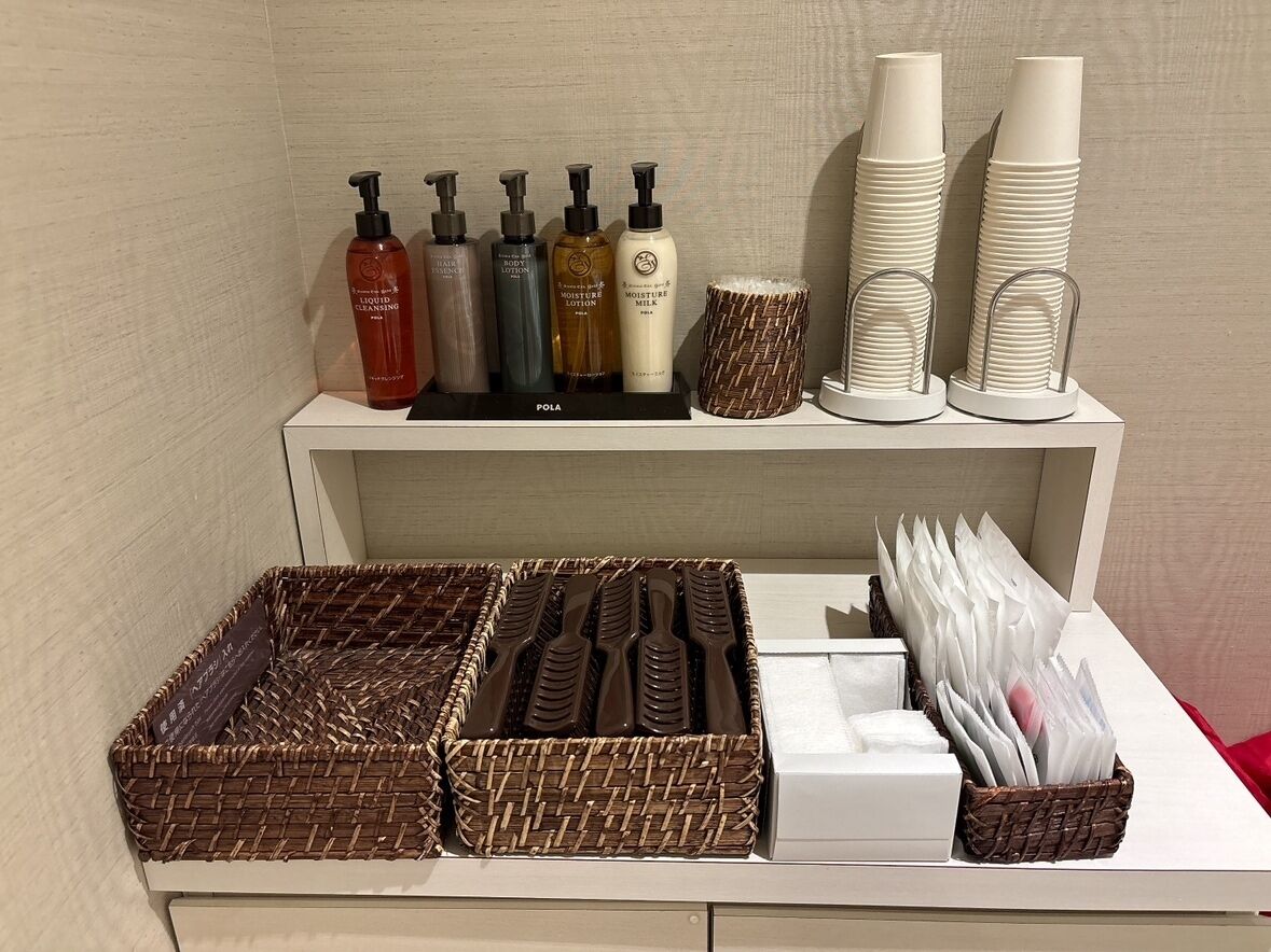 A shelf with toiletries and paper products.