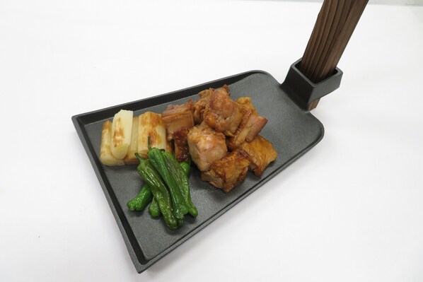 A rectangular tray with various food items including green vegetables and meat. - Dormy Inn Korakuen Hot Springs (Tokyo)