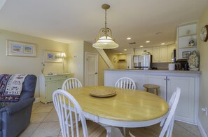 Cozy living space with a dining area, kitchen, and comfortable seating.