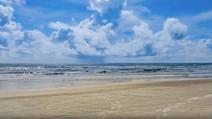 A beach with a sandy shore and waves. - Sandpiper 228 - Paradise Found at Crescent Sandpiper 228 (St. Augustine)
