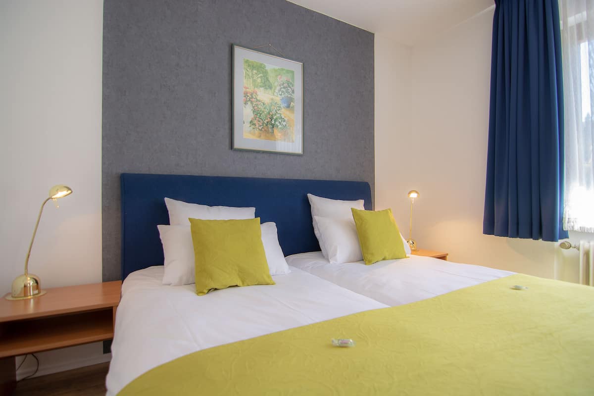 Standaard kamer, 1 twee- of 2 eenpersoonsbedden | Gratis wifi, beddengoed