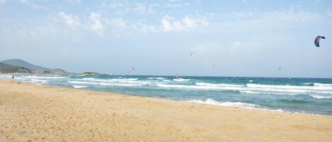 Sun loungers, beach umbrellas, beach towels