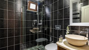 Shower, hair dryer, slippers, towels