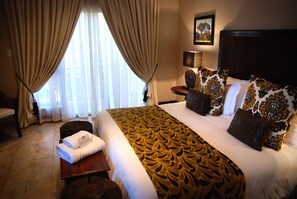Premium bedding, free minibar items, in-room safe, desk