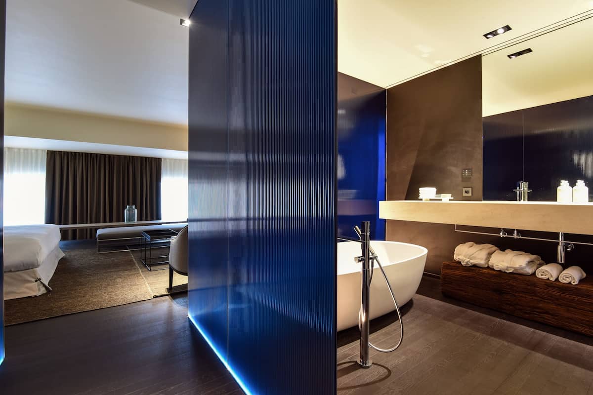 suite, bathtub | bathroom | rainfall showerhead, free toiletries, hair dryer, bathrobes