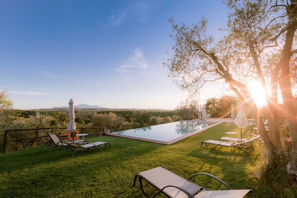 Seasonal outdoor pool, pool umbrellas, pool loungers