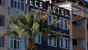 A hotel with a sign reading "ECE HOTEL."