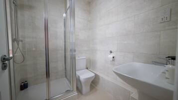 Separate tub and shower, free toiletries, hair dryer, slippers