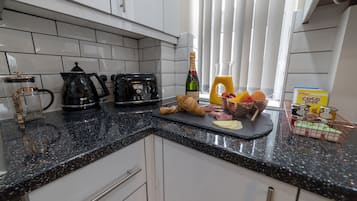 Fridge, microwave, stovetop, coffee/tea maker