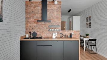 Exclusive Studio Suite | Private kitchen | Fridge, stovetop, dishwasher, electric kettle