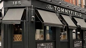 A black storefront with the sign "The TOMMYFIELD" and the number "185" above the entrance. - The Tommyfield (London)