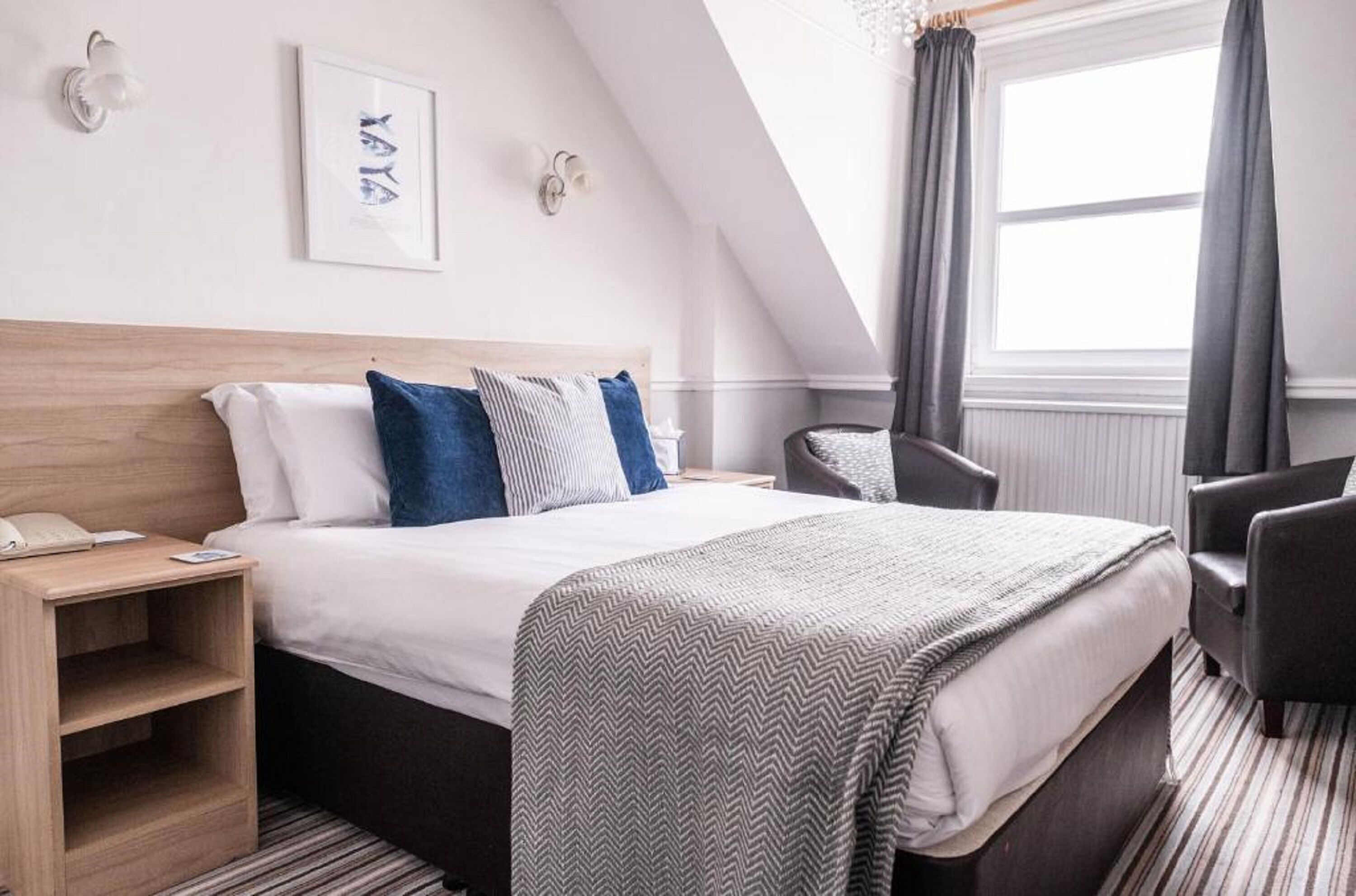 In-room safe, iron/ironing board, free wired Internet, bed sheets