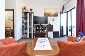 Apartment, 2 Bedrooms (1223/11185) | Living area | Flat-screen TV