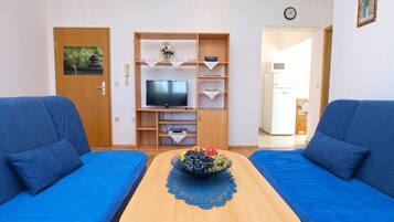Apartment, 1 Bedroom (143/309) | Living room | Flat-screen TV