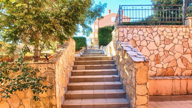 A stone staircase leading up to a building with a metal railing on top. - Apartment Fatima 1514 (Pula)